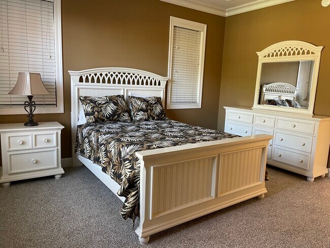 Queen bed, dresser, nightstand - 415 E Romana St Condo Unit #205