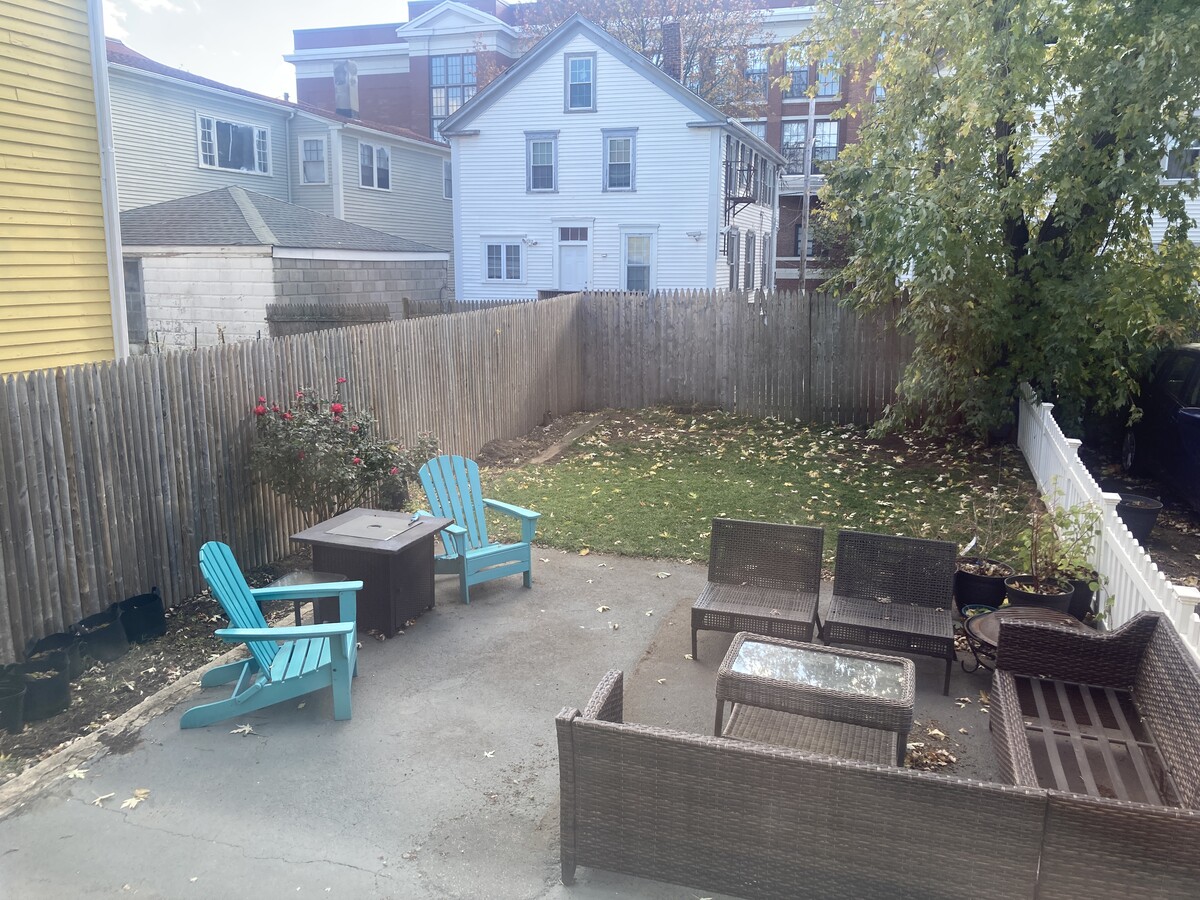 Fenced backyard with patio & grass area - perfect for pups! - 12 Armenia St Apartments Unit 2