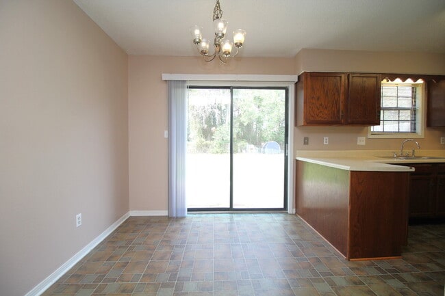 Photo - -Bed, 1.5-Bath Duplex in Bellview with Garage, Indoor Laundry, and Private Fenced Backyard