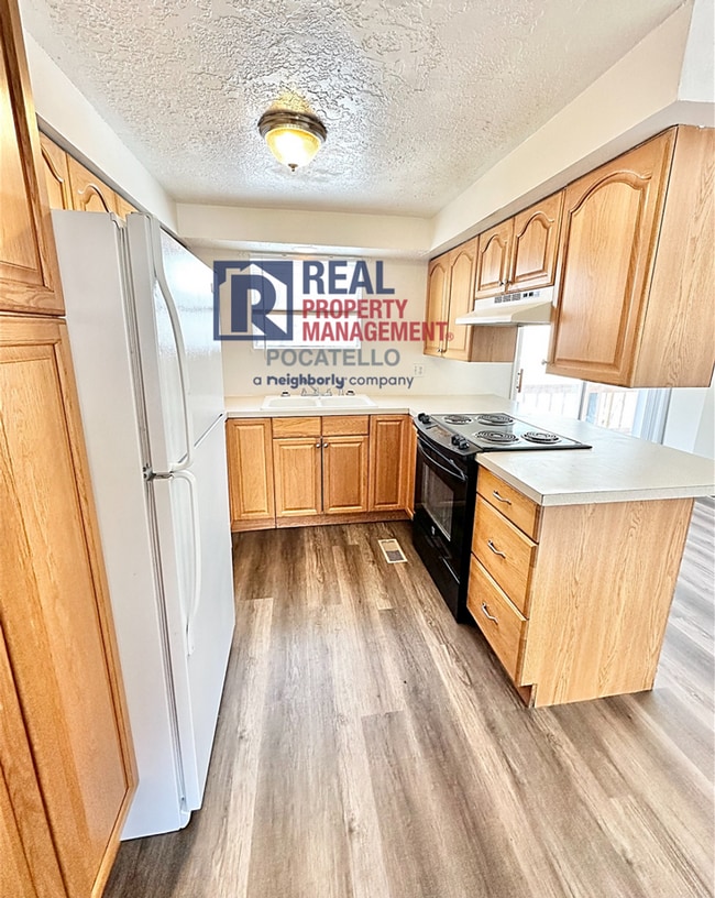 Photo - Spacious 4 Bed / 2 Bath Duplex | Garage + Split-Level Layout | Pet Negotiable