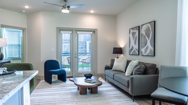 The Cypress: 1BR, 1BA- Living Room - The Waters at West Village