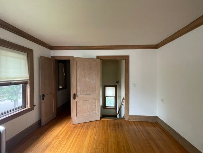 View of front entrance from living room. Door on the left leads to a walk-in closet. - 4235 Pleasant Ave Unit Upper