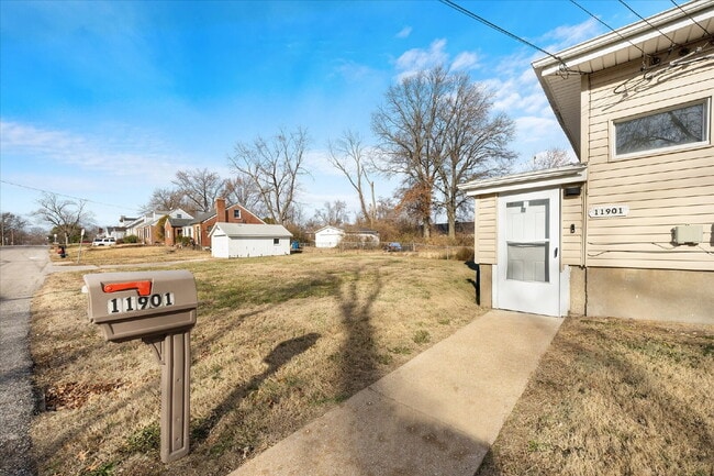 Photo - "Charming 3-Bed Haven with Hardwood Floors & 2 Full Baths in St. Louis!"  Hazelwood Schools.  Sec...