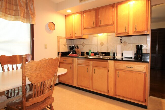 Bright, spacious kitchen with granite countertops