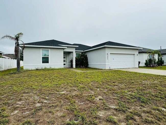Building Photo - Beautiful New 3-Bedroom Home with Spacious Layout & 2-Car Garage in Poinciana Villages