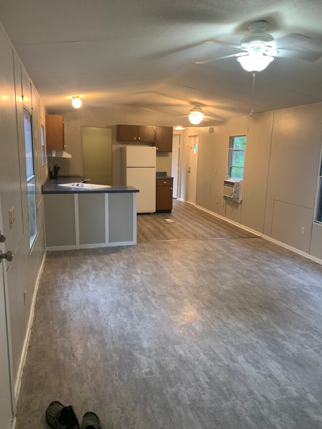 Kitchen with new flooring and attached wash room
