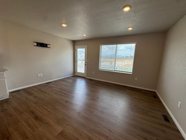 Photo - Modern 3-Level Home with Dual Balconies, Open Floor Plan & Bonus Flex Space