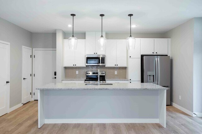 Kitchen island with stainless steel appliances