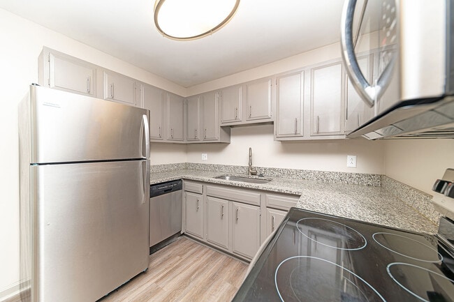Kitchen with granite counters and stainless appliances