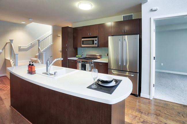 Kitchen islands with quartz countertops - 5550 Wilshire at Miracle Mile by Windsor Apartments