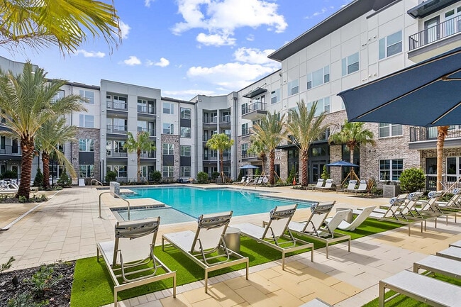 Experience the ultimate in relaxation at this luxury apartment's poolside oasis. - RISE Baymeadows
