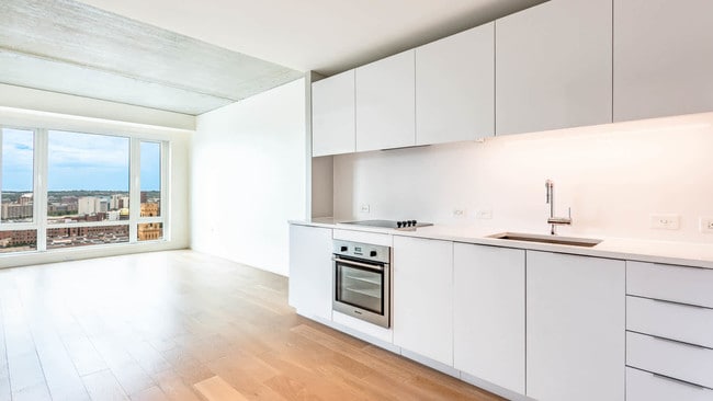 Kitchen with Paneled Appliances and Quartz Countertops