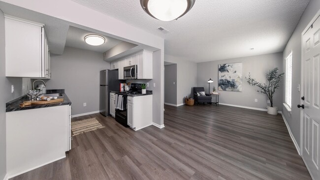 Enjoy the seamless flow from the modern kitchen to the spacious living room.