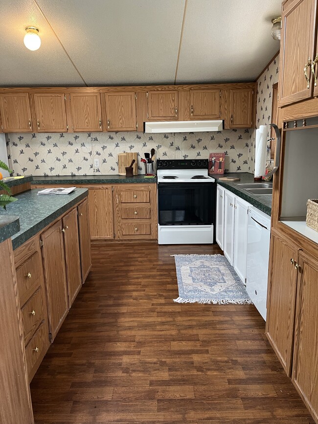 Dining and den open to kitchen - 2301 Wildcat Creek Rd