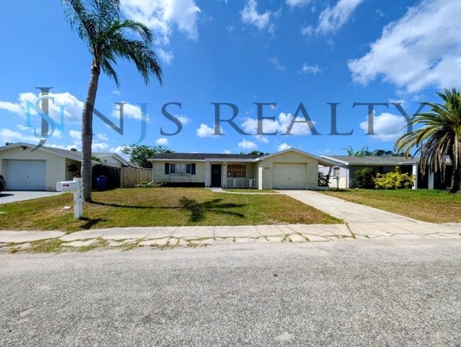 Building Photo - Gorgeous 3/2/1 1200 Sq. Ft. with fenced yard, all tile floors, custom baths and remodeled kitchen!!