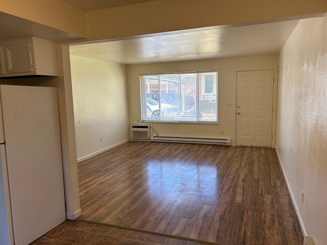 Living rooms w/ AC - Quail Ridge Apartments