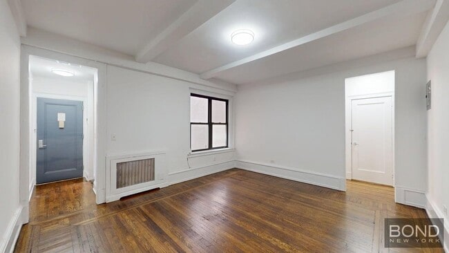 Building Photo - 140 W 55th St Unit 5A Rental