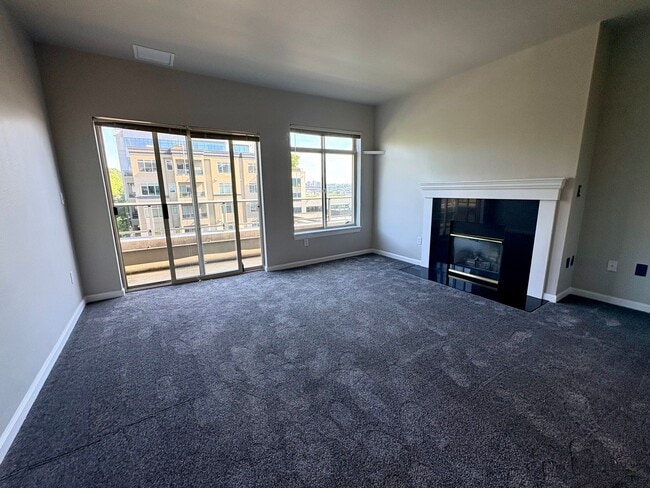 Photo - Top-Floor Corner 2BR with Lake Union Views + Garage Parking Included!