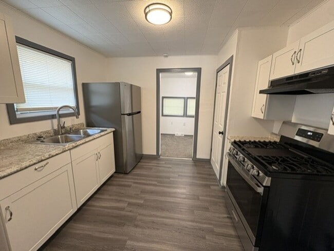 Photo - Move-In Ready 2-Bedroom Home with Modern Kitchen, Basement & Front Porch