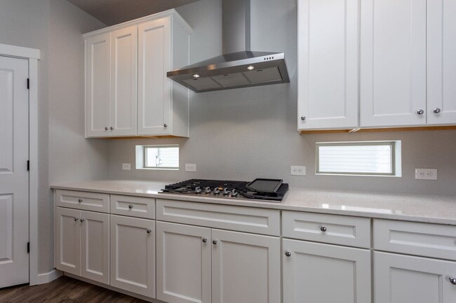 Photo - Exceptional 4-Bedroom Home with Dual Fireplaces, Main Level Master Suite, and Spacious Basement -...