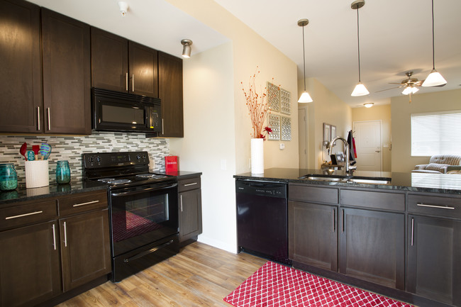 Unit Kitchen - SunSTONE at MarketPlace Apartments