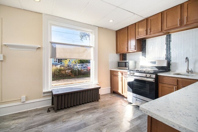 Photo - Spacious 1bed/1bath on main floor of with tons of windows! - Ask about our no security deposit op... Unit 1