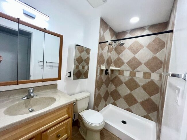 Photo - Stunning 4BR Townhome with Hardwood Floors, Private Patio, Community Pool & 2-Car Garage!