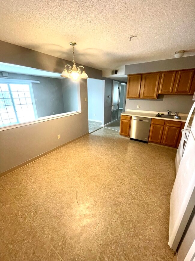 Kitchen view from Door - Creekside Lane Apartments