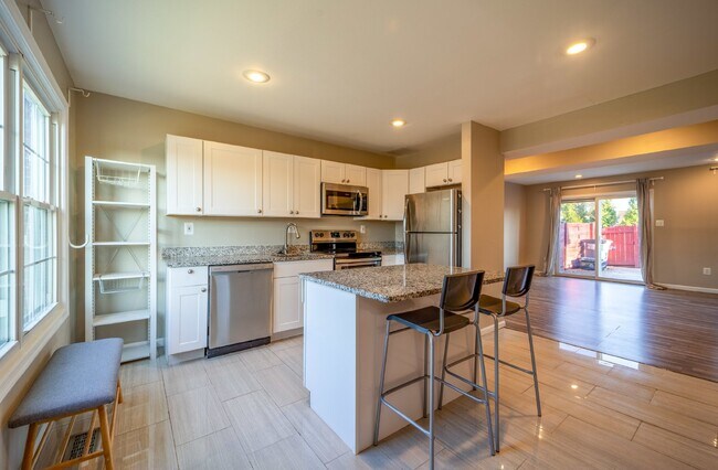 Photo - Spacious 3-Level Townhouse with Finished Basement and Fenced Patio