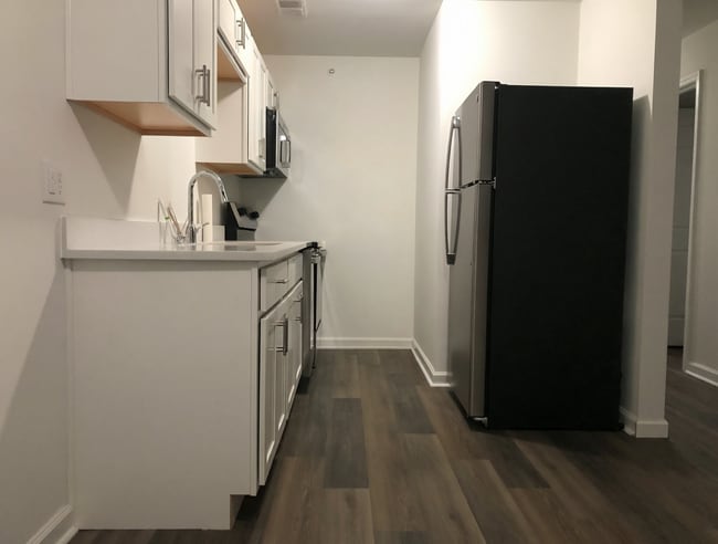Renovated galley kitchen with new appliances. - 261 Simpson Ave Unit 226