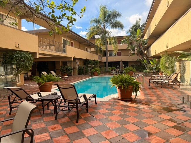 Resort-style heated pool and courtyard — steps from your front door - 970 Palm Avenue Unit 107