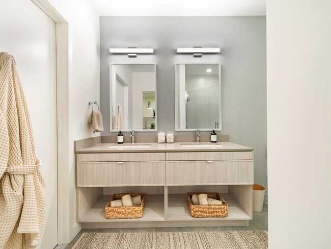 A double vanity with clean finishes, ample storage, and space to get ready with ease.