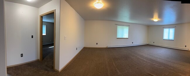 Expansive living room with multiple windows for great natural light. - 2979 Badger Rd Unit D