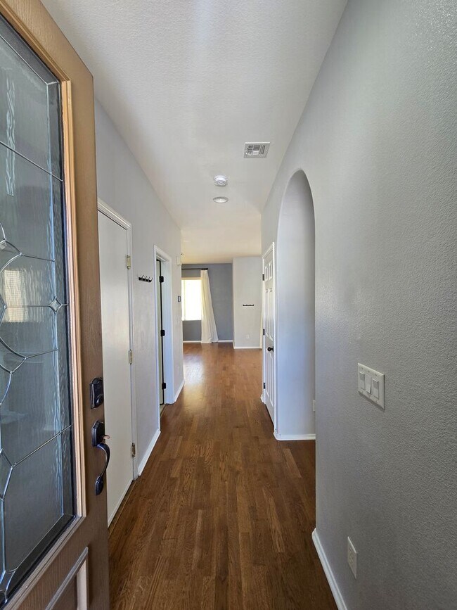 Photo - Step outside to a spacious, larger-than-average Las Vegas backyard complete with lush artificial ...