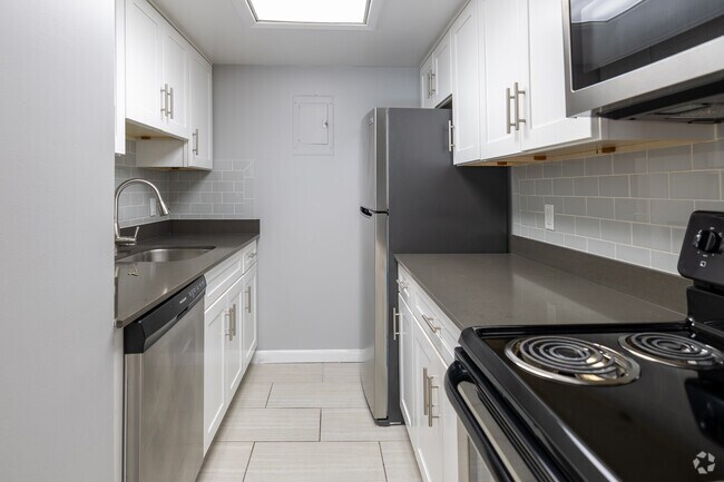 2BR, 1BA, 1/2BA - 1,396SF - Kitchen - Audubon Living