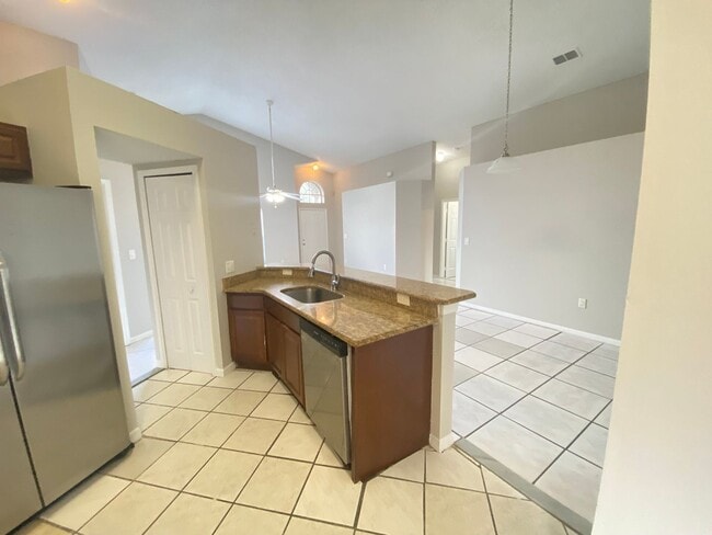 Photo - 3 Bed 2 Bath Home with Stainless Steel Appliances Near Poinciana Pkwy!