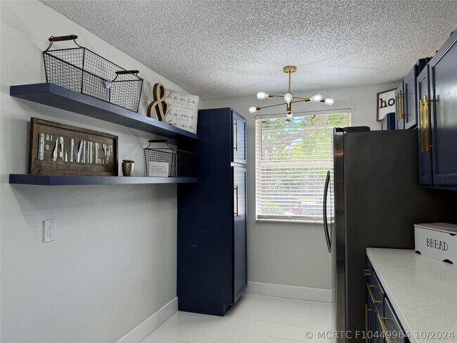 Photo - 8891 Wiles Rd Unit 208