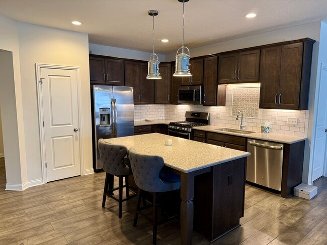 Kitchen w/ Island & Pantry - 6120 Jadkins Way Unit Jadkins