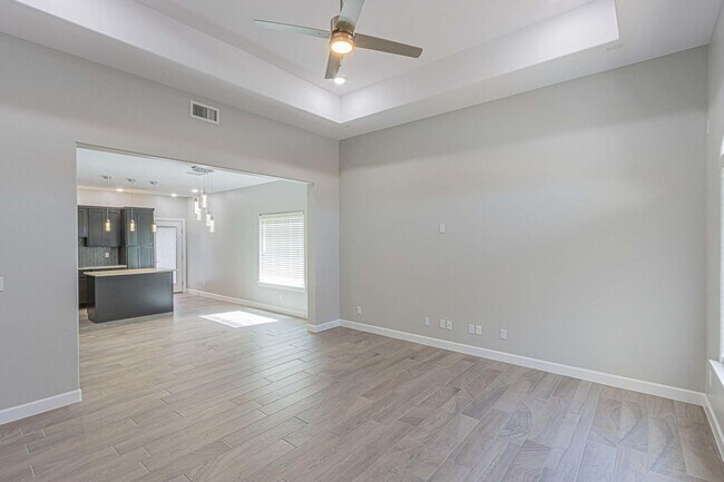 Photo - Modern open floor plan, perfect for comfortable living and entertaining.