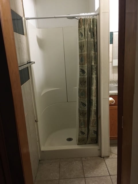 Shared shower with lockout door
