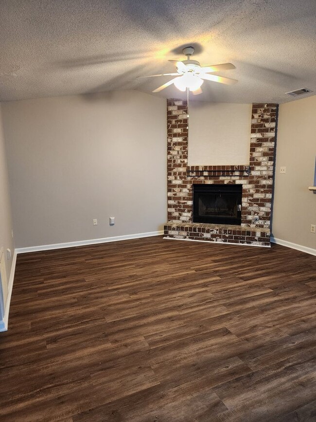 Photo - Spacious 2 bedroom 2 bath townhome with walk in closets, fireplace, and washer/ dryer included.