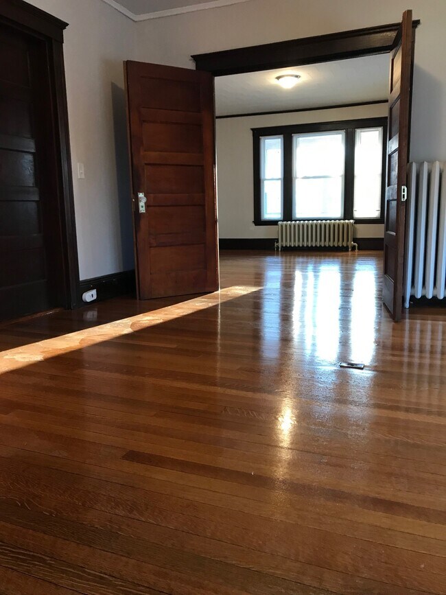 Living room & bedroom in back - 82 Bridge St