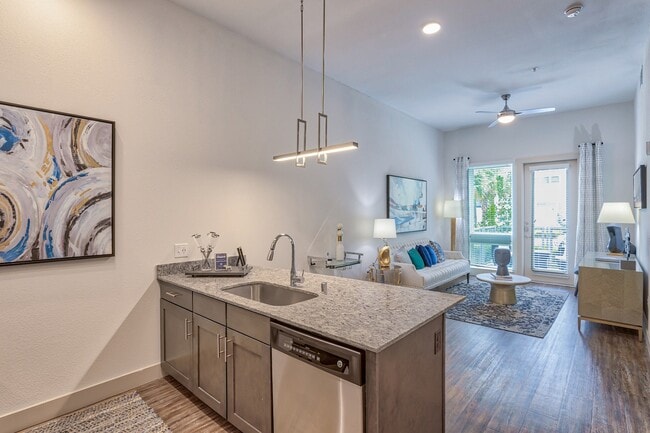 Open concept living at its best, with a seamless flow from the kitchen to the living room for easy entertaining. - Windsor Metro West