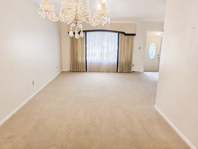 Photo - Spacious 3-Bedroom Split-Level with Formal Dining Room, Fireplace, and Fenced Backyard