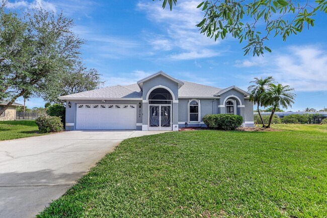 Photo - A BOATER'S PARADISE WITH THIS STUNNING 3 BEDROOM, 2 BATH WATERFRONT POOL HOME W/DOCK & BOAT LIFT ...