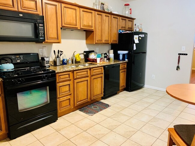 Photo - 2 Bedroom Home on Pius St Available April 1- Parking included.  Central Air.  Washer and Dryer.