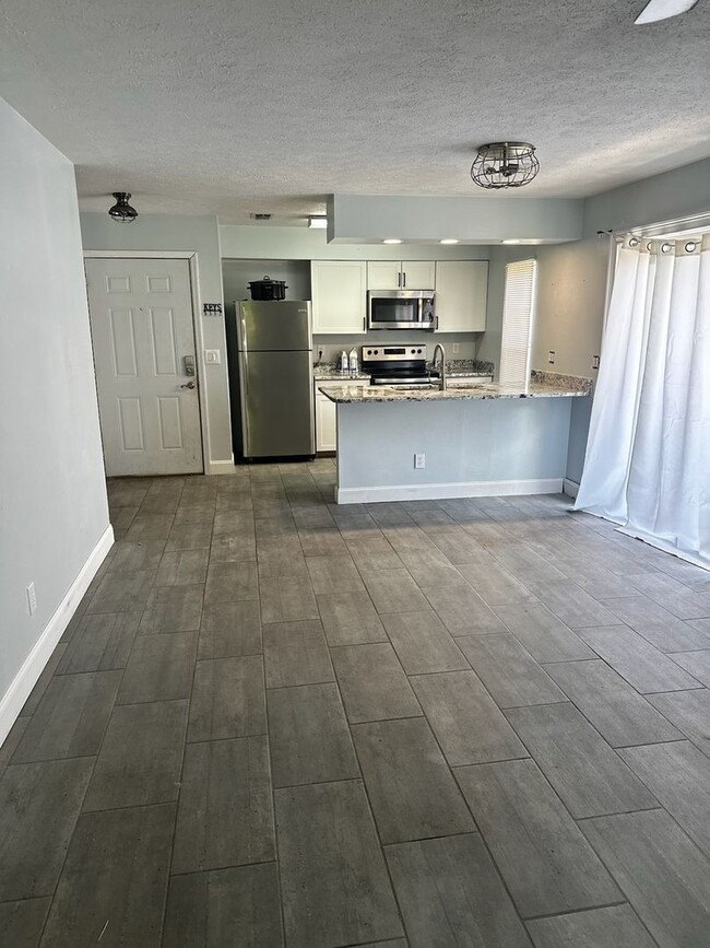 Photo - Cozy & Convenient 2 Bedroom, 1 Bath Duplex with Large Yard & Deck