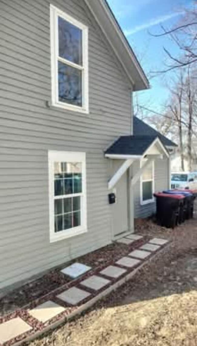 Private side door entrance with key pad lock - 109 E North St Unit Upstairs