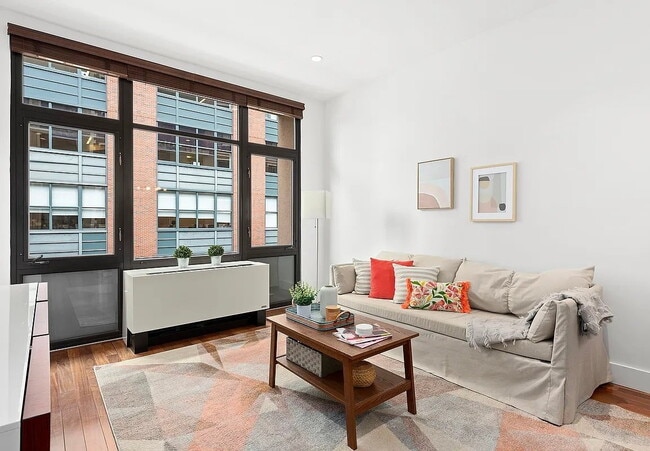 Building Photo - Enjoy this modern apartment’s generous nat...