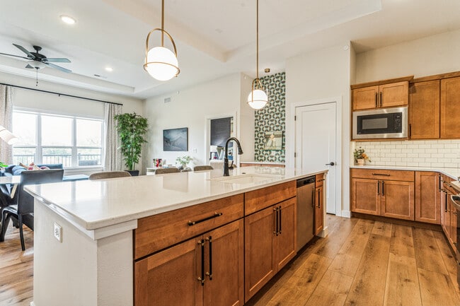 Large kitchen island with bar area in back - 1953 1st Ave SE Unit Top-floor Condo #503